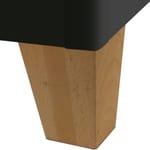 Zoomed-in view of stainable wood leg used for Oak Street Manufacturing vinyl restaurant booths and benches